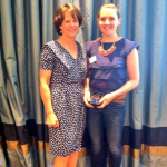 'Laura Marshall being presented with the award for Best Poster Presentation by prof. Pip Logan