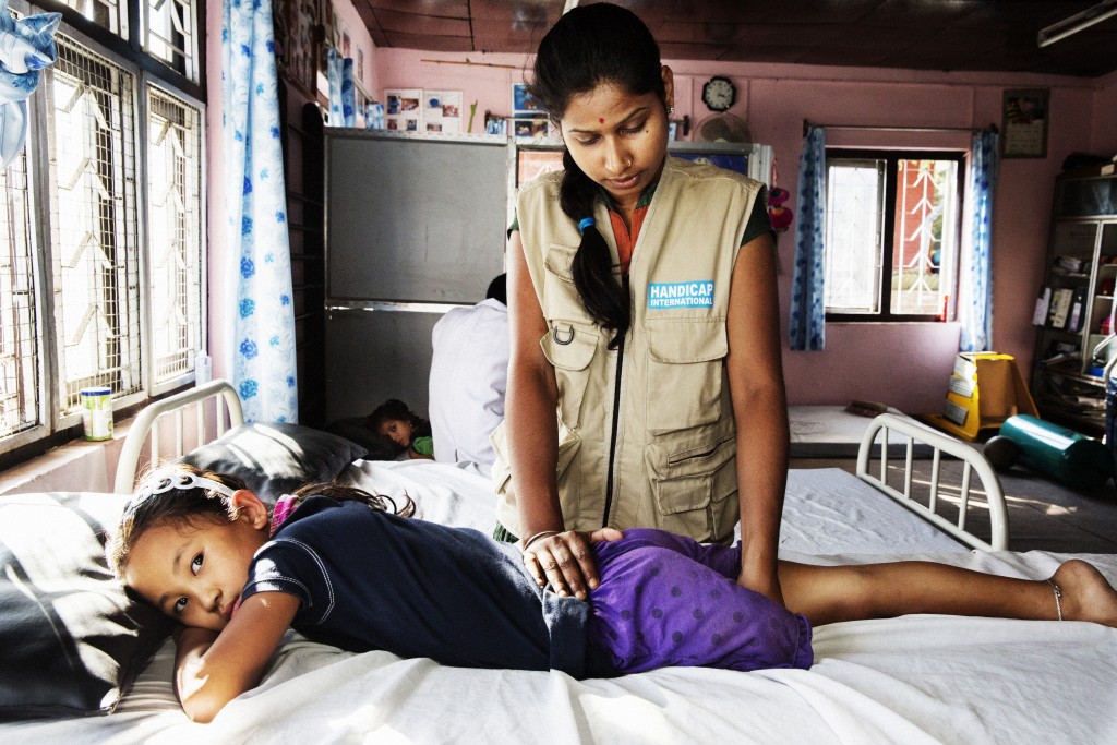 Khembro, 7, during a rehabilitation session with one of Handicap International physiotherapists. She lost her leg in the Nepal earthquake and has followed rehabilitation sessions with Handicap International for over eight months. She has recently received a prosthesis. (Copyright: © Tim Dirven / Handicap International)