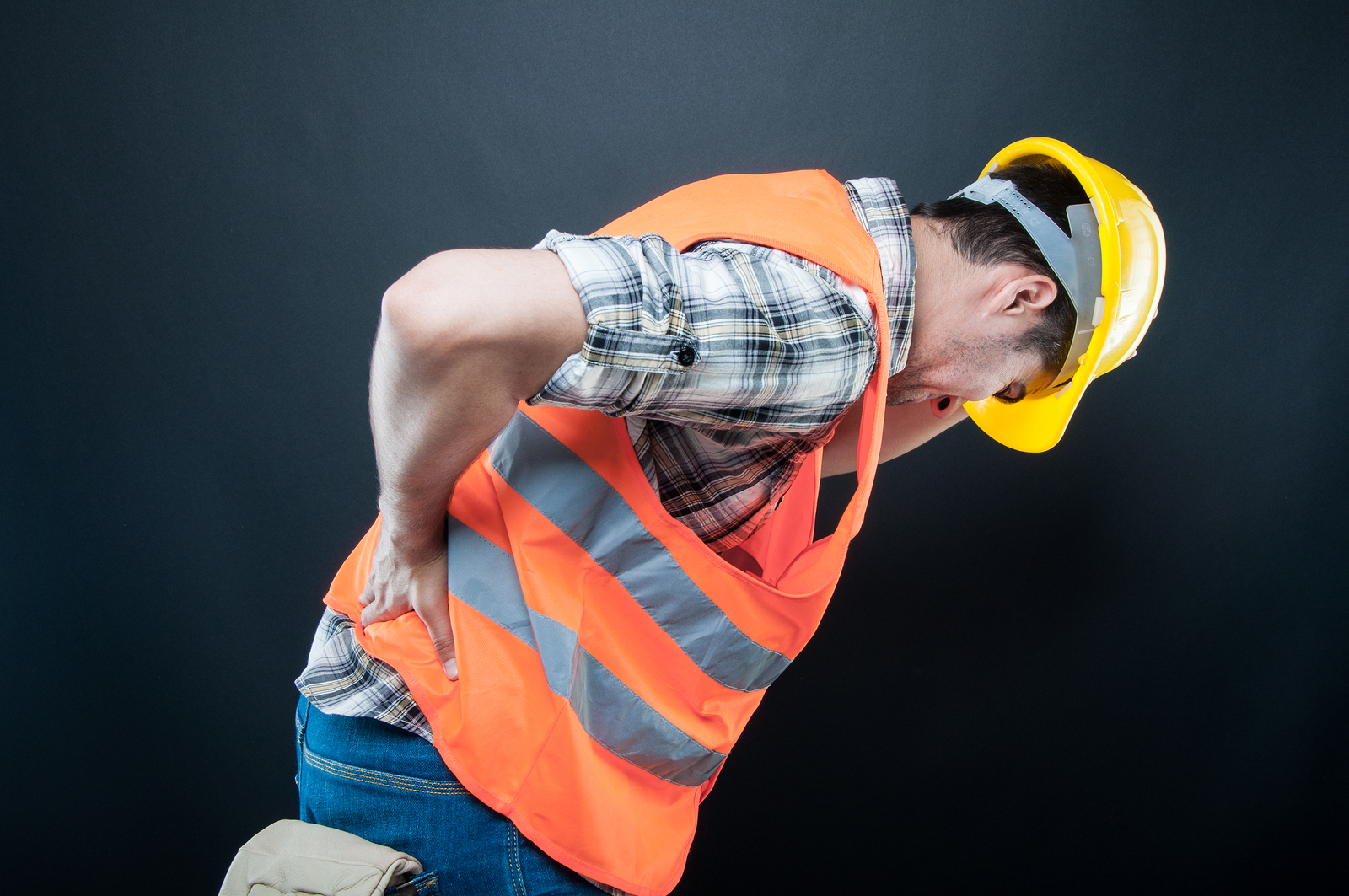 Constructor Holding Back And Bending Over Like Hurting