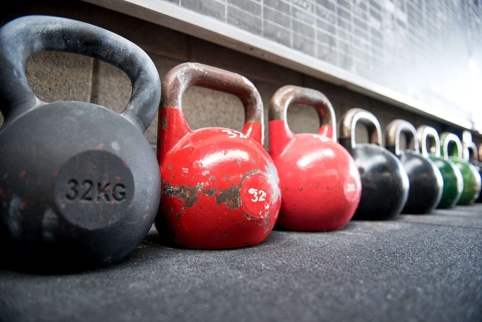 Long Receding Row Of Kettlebell Weights In A Gym