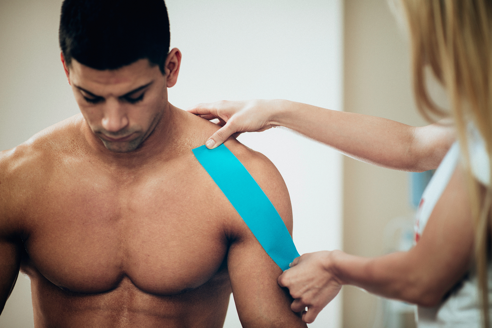 Physical Therapist Using Kinesio Tape
