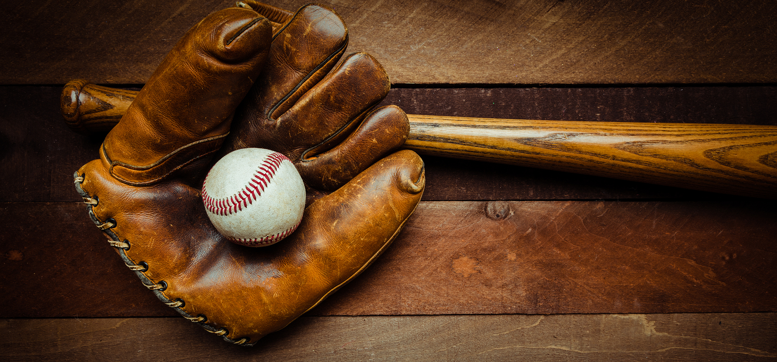 A Group Of Vintage Baseball Equipment, Bats, Gloves, Baseballs