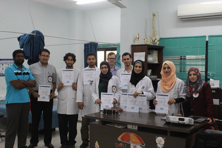 Physiopedia students in Gaza receiving their certificates from the amputation course