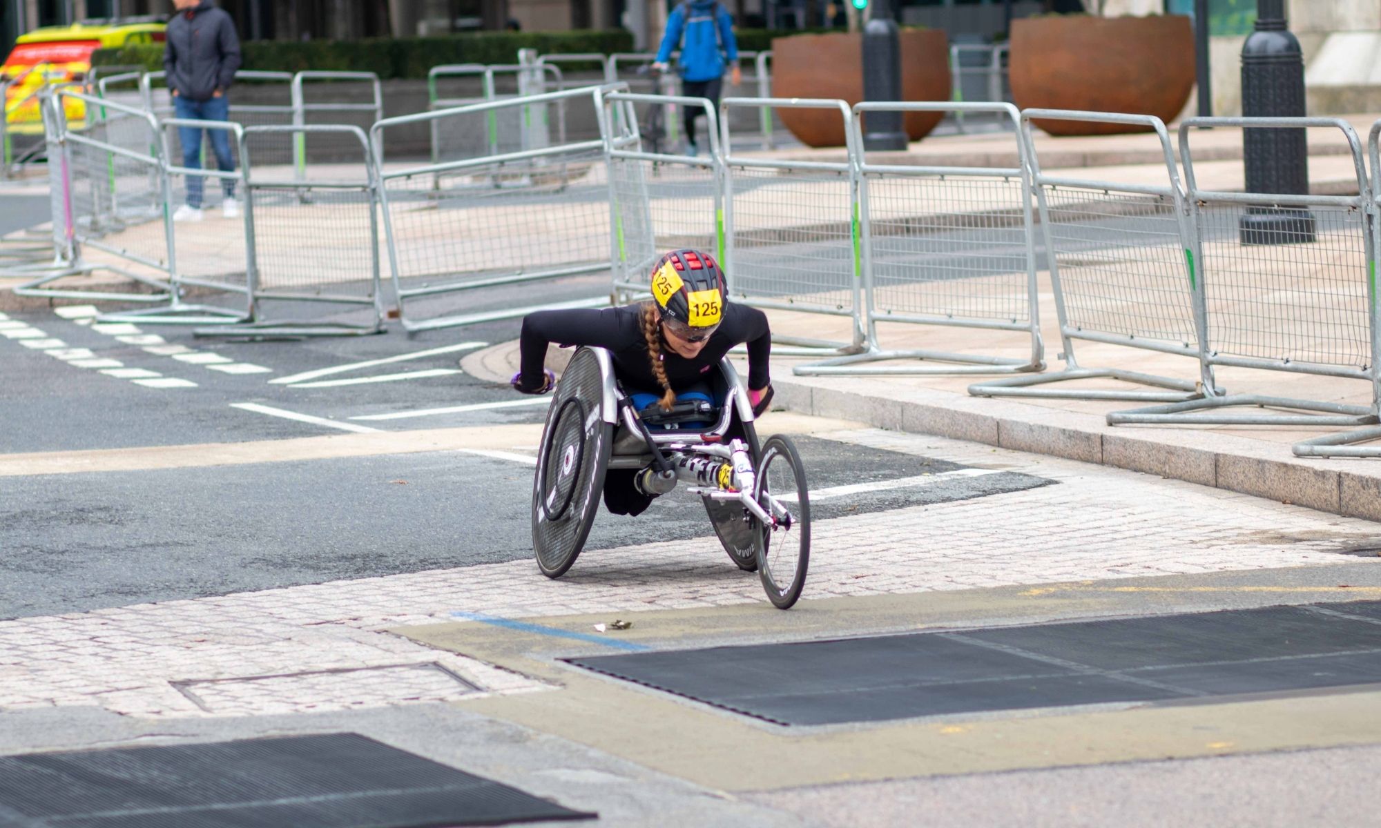 Female competitor racing in paralympic para-cycling event