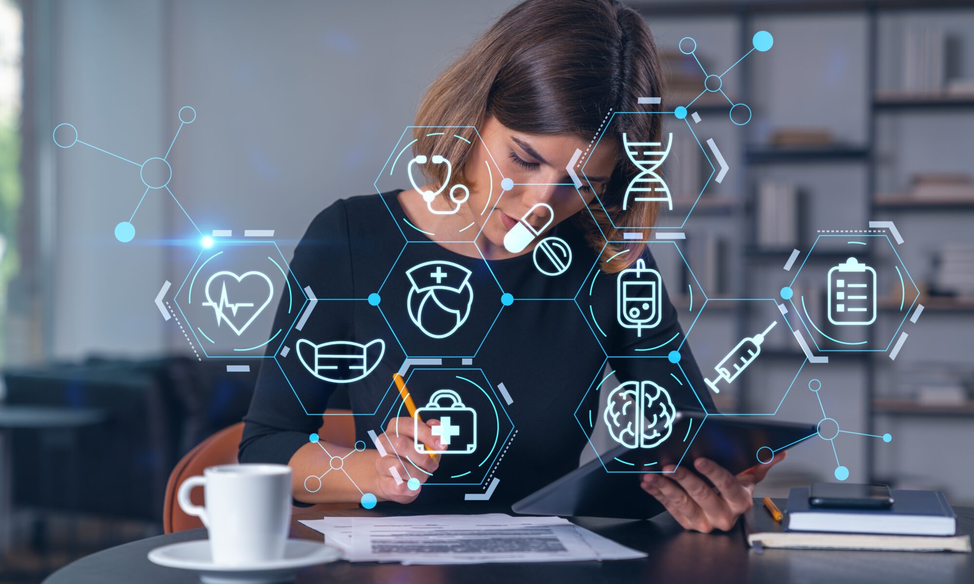 Female working at desk on electronic device with medical symbols in the foreground used for the Physiopedia Plus AI programme